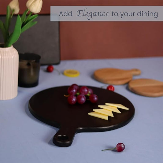 The Fine Living Co. Black Charcuterie Board, Round Paddle Board with Long Handle, Mango Wood Serving Platter for Meat, Pizza, Bread, Food-Grade Wooden Serving Trays, 16”x12”, 0.6" Thick