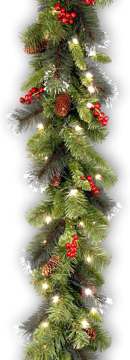 National Tree Company 9 ft Pre-Lit Crestwood Spruce Artificial Christmas Garland, Christmas Decoration with Glitter, Pinecones, Red Berries, 50 Clear Lights, 180 Tips, Green