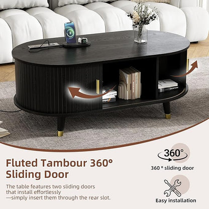 Mid-Century Fluted Oval Coffee Table with 360° Tambour Doors, Hidden Storage, Solid Wood Legs & 2 AC+2 USB Charging Station, Modern Coffee Table for Living Room, Apartment, Black