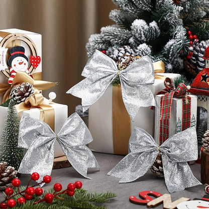 Cindeer 24 Pcs Silver Christmas Bow Decorations 6 x 6 Inches, Glitter Holiday Ornaments Sequin Ties Bows for Xmas Tree, Wreath, DIY Crafts, Gift Wrapping, Party Decor