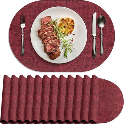 Placemats Set of 12 Washable, Heat Resistant Table Placemats Wipeable Faux Leather Oval Place Mats Non Slip, Waterproof Oval Table Mats for Indoor Outdoor, Wine Red