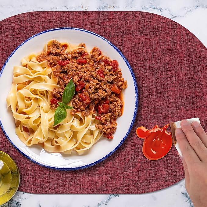 Placemats Set of 12 Washable, Heat Resistant Table Placemats Wipeable Faux Leather Oval Place Mats Non Slip, Waterproof Oval Table Mats for Indoor Outdoor, Wine Red