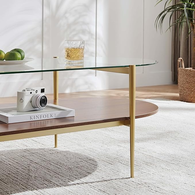 X-Large Oval Glass Coffee Table, Mid-Century Modern Design, L47 x W24 x H17 inch, for Living Room, Clear Glass Top and Walnut Finish Wood Shelf, Conical Legs with Gold Finish Frame